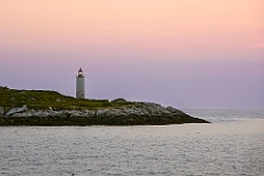 Remote Franklin Island Light Shines Above Rocky Shore